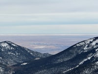 a view from the top of a mountain overlooking a valley